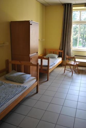 Postel nebo postele na pokoji v ubytování Hostel Katowice Centrum