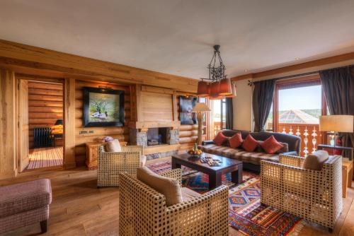 a living room with a couch and chairs at Michlifen Resort & Golf in Ifrane