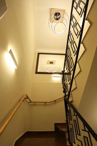 a staircase in a building with a ceiling at Saray Hotel in Prizren