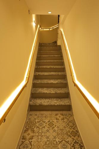 a stairway with a set of stairs with lights at Saray Hotel in Prizren