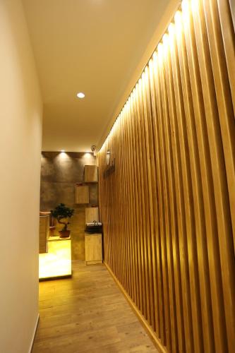a hallway with wood paneled walls and a wooden floor at Saray Hotel in Prizren