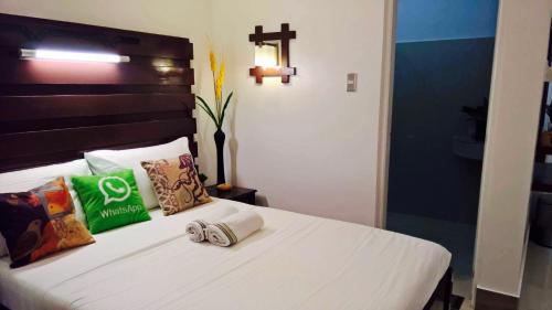 Ένα ή περισσότερα κρεβάτια σε δωμάτιο στο SunValley Tourist Inn