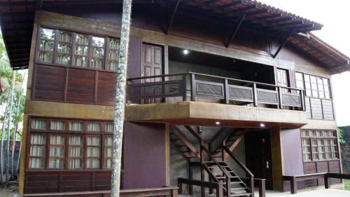 a small house with a balcony and a staircase at Ceta Ecotel in Macapá