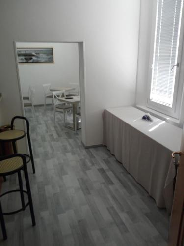 a room with a bed and a table and chairs at Hotel La Cantina in Alfonsine