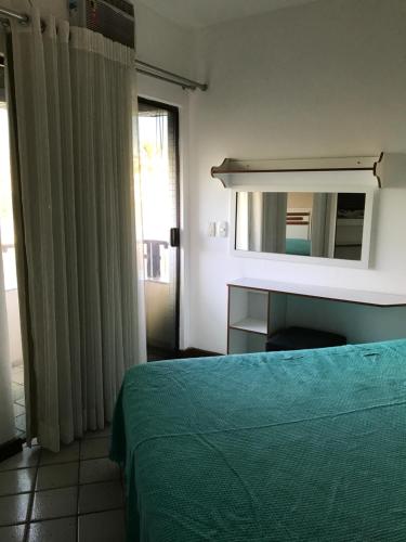 Katil atau katil-katil dalam bilik di Apartamento Velozo Santos