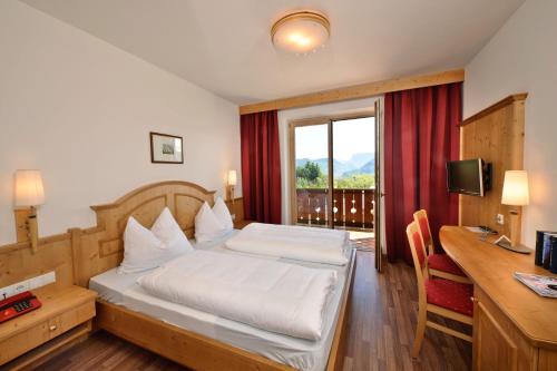 Postel nebo postele na pokoji v ubytování Hotel St. Justina Hof