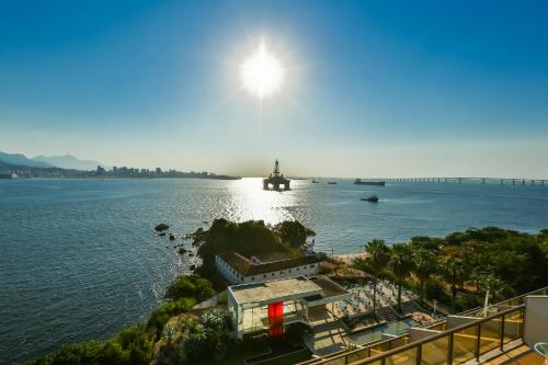 a view of a large body of water with a boat at Hotel Orizzonte Niteroi by Atlantica in Niterói