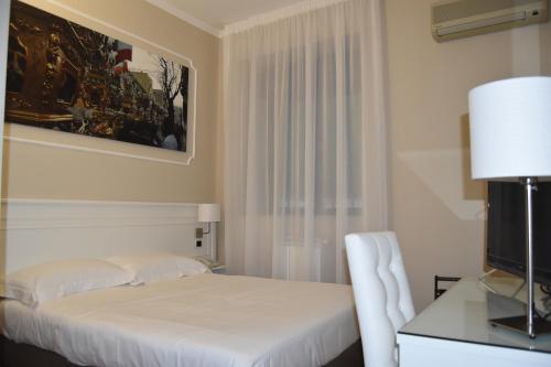 Ένα ή περισσότερα κρεβάτια σε δωμάτιο στο Hotel Centrum