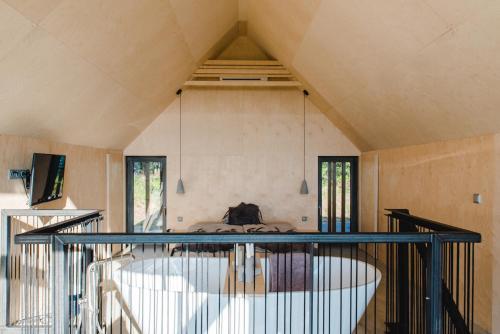 a room with a large tub in the center of a room at Weinloft II by WEINLOFTS in Eisenberg an der Pinka