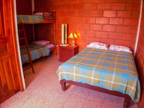 Tempat tidur dalam kamar di Sol de Playa