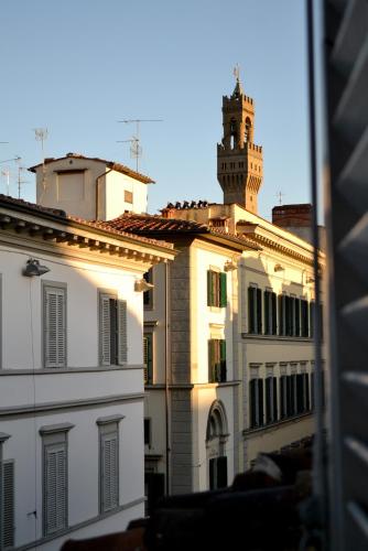 a building with a clock tower on top of it at Domus Duomo in Florence