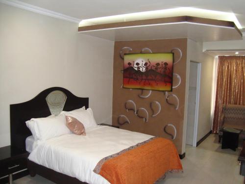 Ένα ή περισσότερα κρεβάτια σε δωμάτιο στο Kismet Hotel