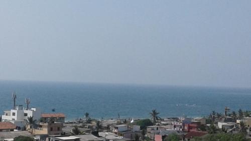 a view of a city and the ocean at Dominic's best in Mount Lavinia