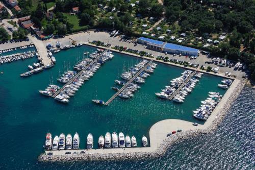 an aerial view of a marina with boats in the water at Stone house Chiara Seaview in Funtana