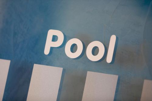 a sign with the word poop written on it at Hotel Blattnerhof in Blatten bei Naters