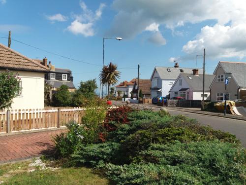 a street in a residential neighborhood with houses at The Slopes in Whitstable
