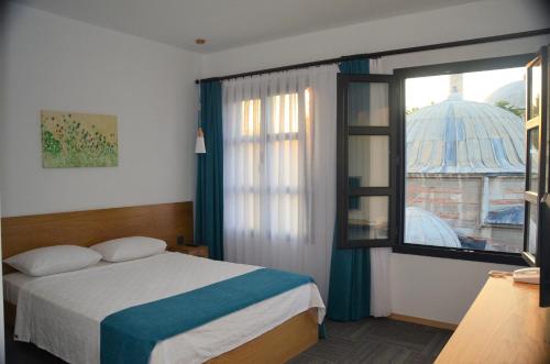 Ένα ή περισσότερα κρεβάτια σε δωμάτιο στο Pera Hotel Lüleburgaz