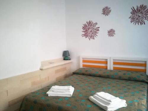 Postel nebo postele na pokoji v ubytování Camere D'Aragona