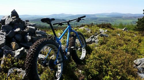 a bike parked on top of a pile of rocks at Hilltop Seaview Apartment in Wicklow