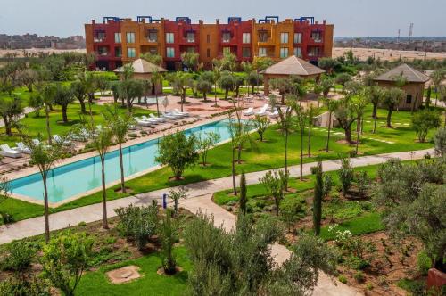 an aerial view of a resort with a pool and buildings at Appartement Priv&eacute; au Vizir Center Marrakech in Marrakech