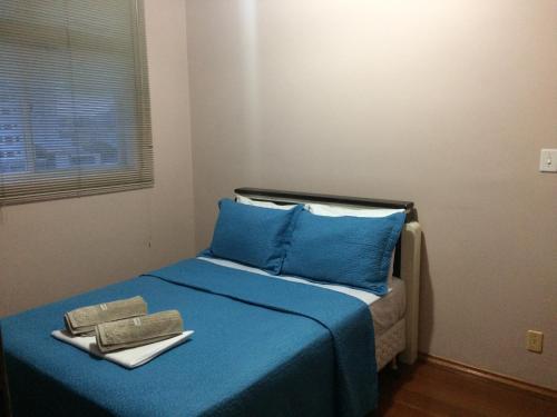 Säng eller sängar i ett rum på Apartamento Uberlândia - BH
