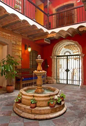 a fountain in the middle of a room at La Casona Hotel Boutique in La Paz