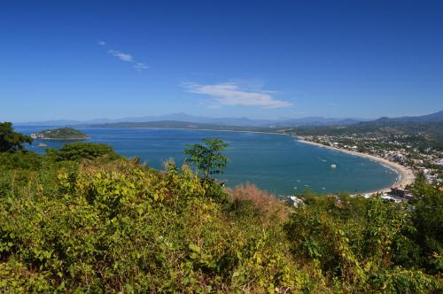 a view of a beach from a hill at MarySol Las Palmas in Rincon de Guayabitos