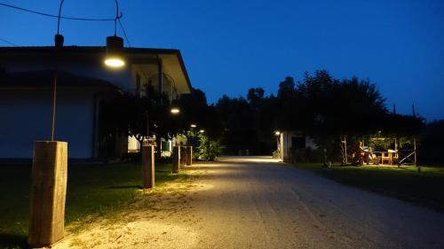 an empty street at night with a street light at Casa Vacanze Feudi 1165 in Borgo Vodice