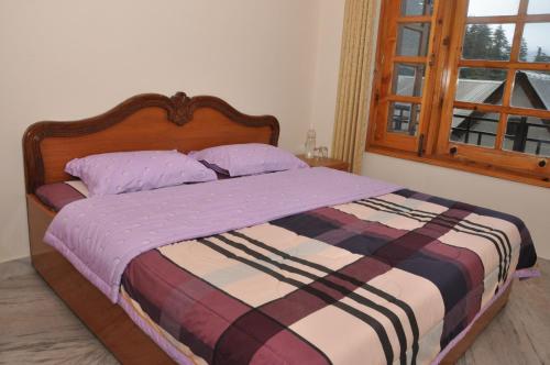 Postel nebo postele na pokoji v ubytování Vipul Home Stay