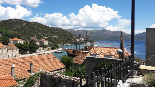a view of a harbor with boats in the water at Emily Apartment in Suđurađ