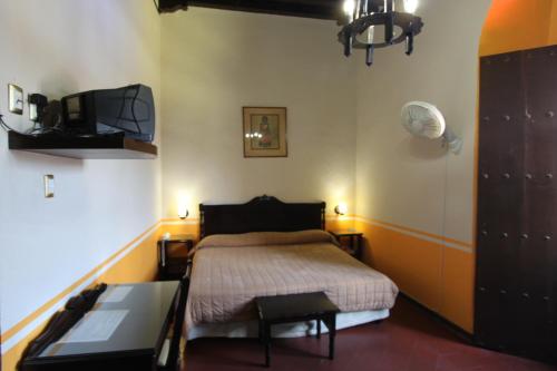 Postel nebo postele na pokoji v ubytování Hotel Monte Alban - Solo Adultos