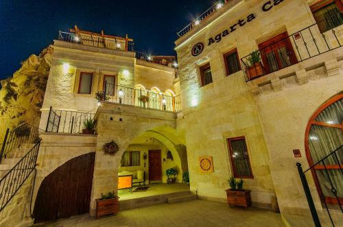 a large building with an archway in a building at Agarta Cave Hotel in Goreme