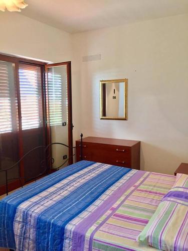 Una cama o camas en una habitación de Terrazza sul mare Pisciotta - Palinuro