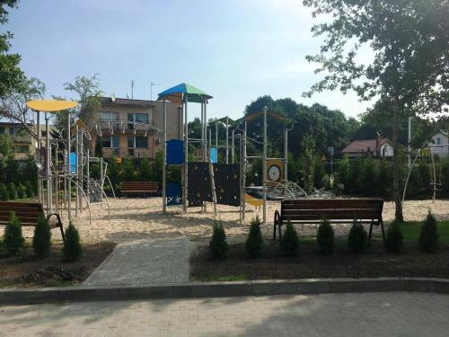 a park with a playground with a play equipment at Przystań Koło Brzegu in Kołobrzeg