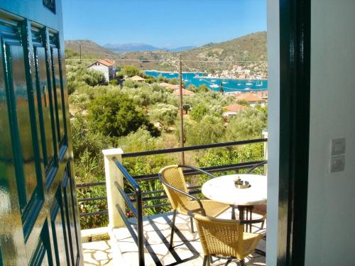 a balcony with a table and chairs and a view at Panorama in Vathi, Ithaka