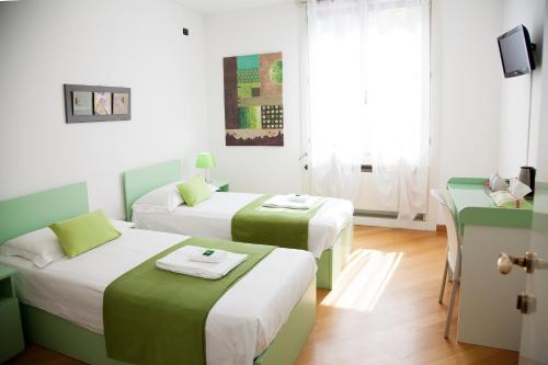 Postel nebo postele na pokoji v ubytování B&B Botton D'Oro Basiglio