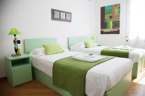 Postel nebo postele na pokoji v ubytování B&B Botton D'Oro Basiglio