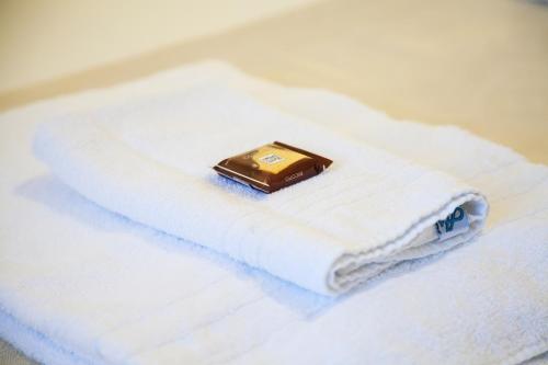 a soap sitting on top of a white towel at B&B Botton D'Oro Basiglio in Basiglio