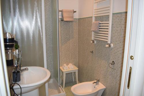 a small bathroom with a sink and a toilet at My Bed Vatican Museum in Rome