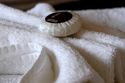 a close up of a white towel with a condom at The Glenferrie Hotel Hawthorn in Melbourne