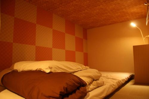 Letto o letti in una camera di J-Hoppers Kumano Yunomine Guesthouse