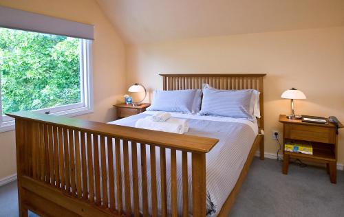 a bedroom with a large bed and a window at Orari Boutique Hotel in Christchurch