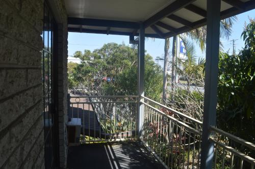 a balcony with a view of the street at Excelsior Motor Inn in Port Macquarie