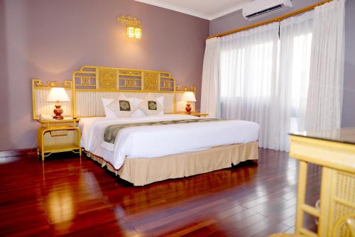 Postel nebo postele na pokoji v ubytování Huong Giang Hotel Resort & Spa