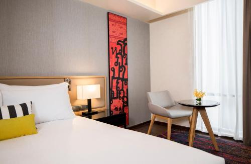 Un ou plusieurs lits dans un hébergement de l'établissement Travelodge Sukhumvit 11