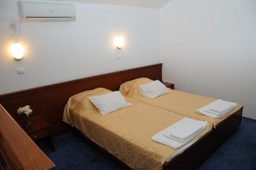 Cama o camas de una habitación en Hotel Norcev