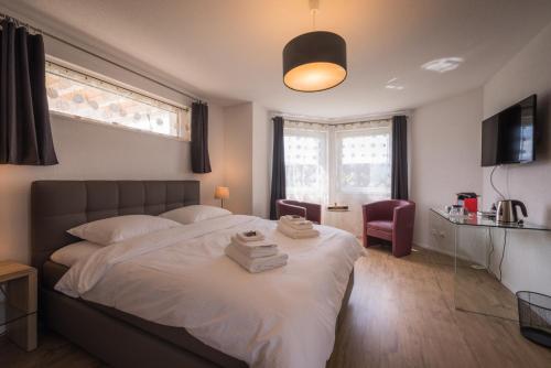 Postel nebo postele na pokoji v ubytování B+B Passifleur