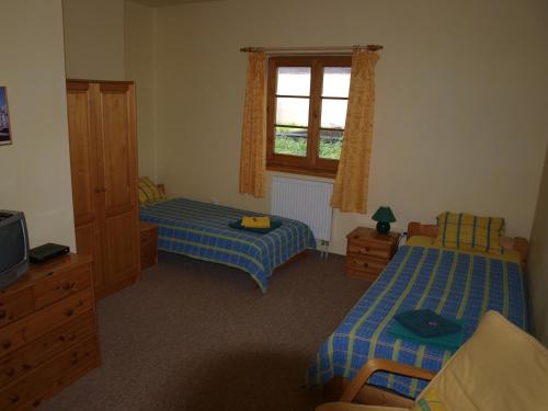 מיטה או מיטות בחדר ב-Hotel U Zvonu