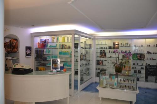 a shop with a display case of cosmetics at Albergo Gatto Bianco in Capri