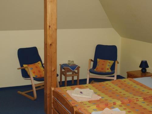 Postel nebo postele na pokoji v ubytování Hotel U Zvonu